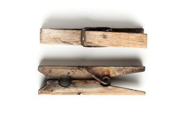 Wooden clothespins isolated on white background