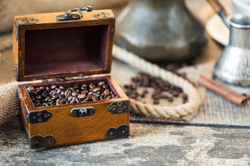 Coffee beans. Roasted coffee beans on the brown wooden table