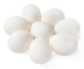 Several white chicken eggs on a white isolated background. Close-up. Top side view.