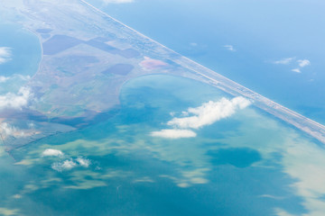 Looking through window aircraft, landing to the airport