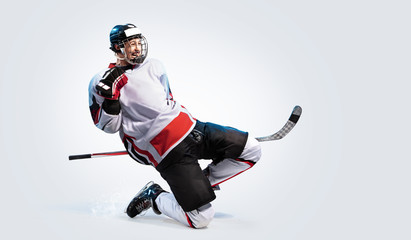 Hockey player isolated in white background celebrate win