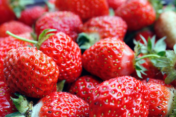 Strawberry. Macro of fresh organic red berries. Fruit background. Close-up.
