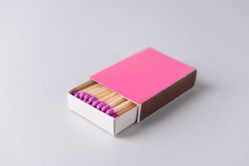 Box with matches on light background