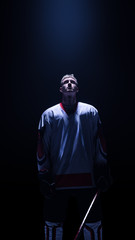 Hockey player isolated in black background wait start
