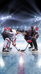 Hockey players starts game around ice arena 