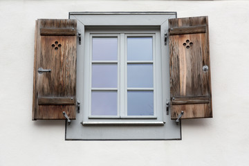 Fototapeta na wymiar Window shutters on gray wall, Burano, Venice