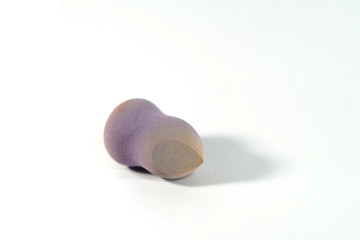 Dirty foundation sponge used isolation on white background.