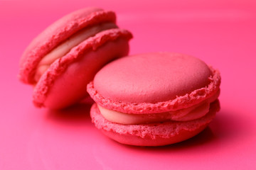 Pink macaroons on pink background. 