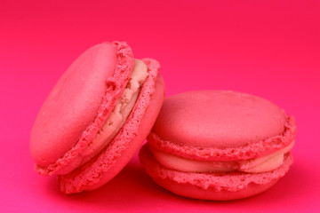 Pink macaroons on pink background. 