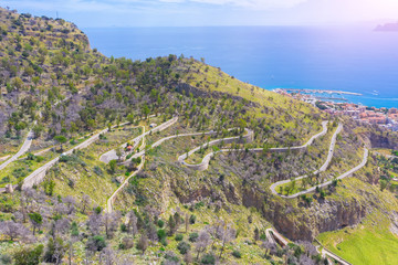 Road serpentine uphill on the coast of Sicily Italy Palermo.