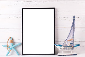 Empty  black frame mockup  with copy space and  summer sea vacation  decorations