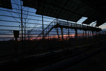 Railway infrastructure at sunset.