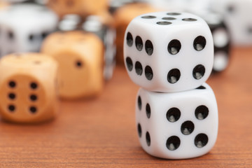 Dice on a wooden table. Concept for business risk.