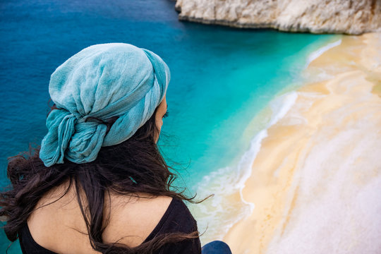 Amazing beach and coastline from Kaputas, Antalya, Turkey. The girl watching the coast of Kaputaş. Holiday, tourism and travel background. Turquoise colored. Lycian way.