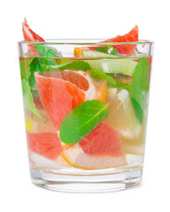 cold drink with different citrus and herbs in glasses on a white background. Cocktail