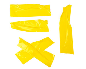 Set of yellow tapes on white background