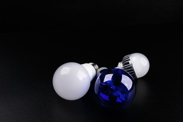 Set with different types of lamp bulbs on black background
