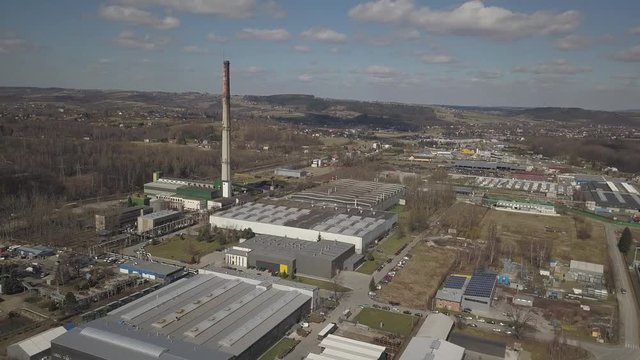 Gorlice, Poland - 3 9 2019: Industrial region of the Carpathian city. Top view of the refinery and auxiliary buildings. Video shot by drone or quadrocopter. Vanity of the day at the factory. Planning 