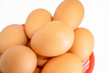 eggs isolated on white background on red basket