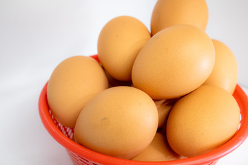 eggs isolated on white background on red basket