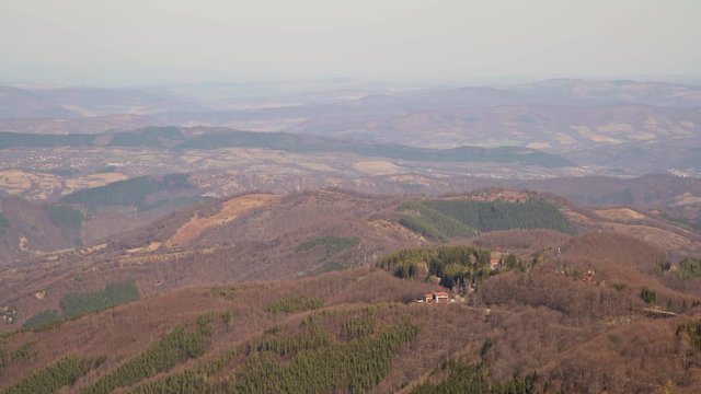 Mountain hut on top of the hill in the woods. Beautiful mountain view from the path from Beklemeto to Kozya Stena, Troyan Balkan, Bulgaria
