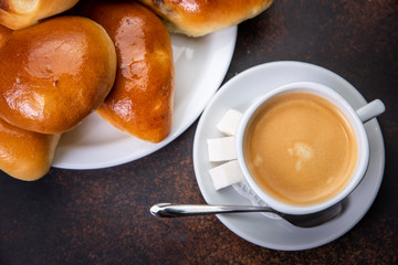 Coffee white cup, croissants on dark retro background. Top view