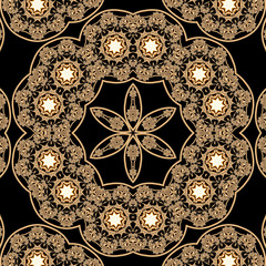 Mandala with gold ornaments and glowing stars on a black background and a flower in the middle