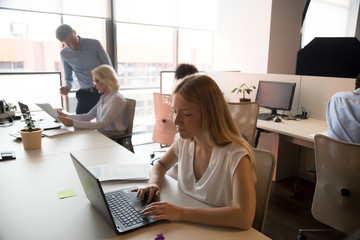 Business people working in modern office, using computers, busy workday