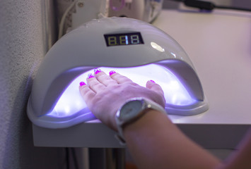 The machine for drying of nails. Accessories for manicure. Drying of acrylic in the machine.