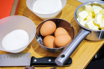 Ingredients for making dessert. Chocolate, eggs, butter, flour