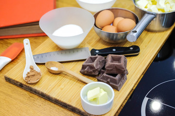 Ingredients for making dessert. Chocolate, eggs, butter, flour
