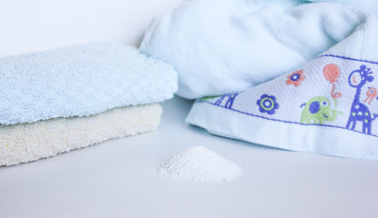  washing powder on a white background with towels