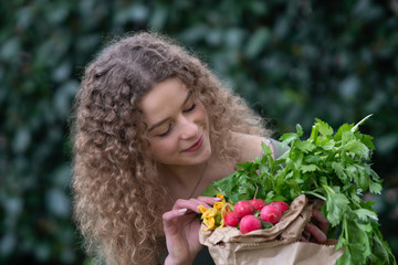 Young woman at the vegetable  food market 