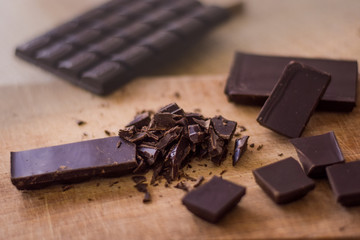Cut chocolate on the wooden board