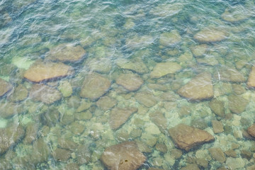 Stony seabed. Pure turquoise seawater. 