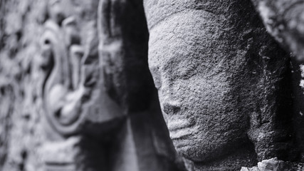 Close-up of stone carving at one of the temples in Angkor Wat, which relates to Hindu mythology and bearing Khmer architectural styles. (Angkor Wat, UNESCO World Heritage, Siem Reap, Cambodia)