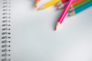 Colorful pencil on notebook, learning concept.