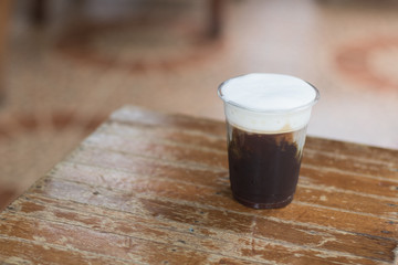 Sparkling Nitro Cold Brew Coffee ready to drink.Outdoor cafe in tropical design.