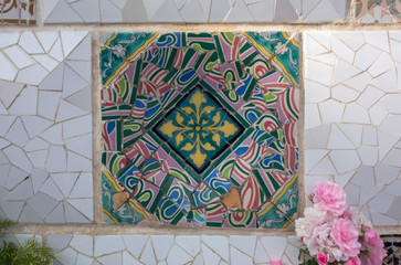 Detail of the famous broken tiles (trencadis) in the Park Güell, Barcelona, Spain.
