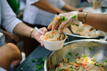 the concept of life problems, hunger in society : concept of charity food for the poor : Hand-feeding to the needy in society