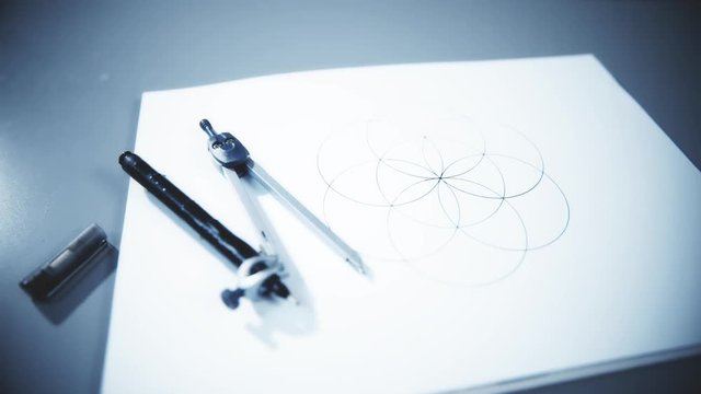 Drawn symmetrical image with compass