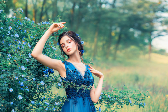gentle image of a nymph in a long elegant elegant dress, a girl like an amazing cornflower flower. field mermaid dreams with her eyes closed, young princess dancing next to a fabulous forest