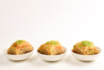 Pistachio baklava on a white background. Dessert.