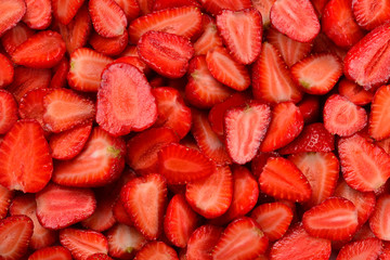 Strawberry slices. Fresh berries macro. Fruit background. Top view.