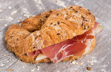 sandwich made with croissant cheese and Parma ham