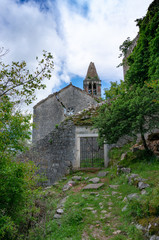 The ruins of an old abandoned Catholic church Stara Zupna Crkva on Mount Vrmac, the town of Prcanj, the Bay of Kotor, Montenegro.