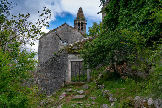 The ruins of an old abandoned Catholic church Stara Zupna Crkva on Mount Vrmac, the town of Prcanj, the Bay of Kotor, Montenegro.