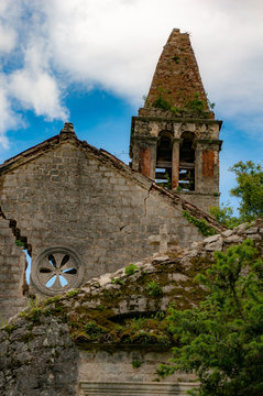 The ruins of an old abandoned Catholic church Stara Zupna Crkva on Mount Vrmac, the town of Prcanj, the Bay of Kotor, Montenegro.