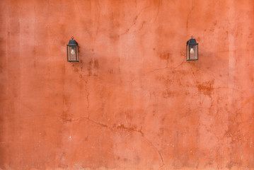 Vintage lamp on red wall background