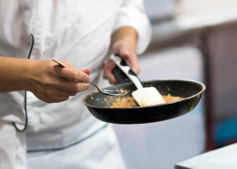 Chef preparing food in the kitchen, chef cooking, closeup